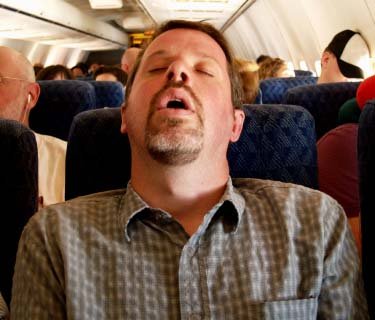 sleeping-on-airplane